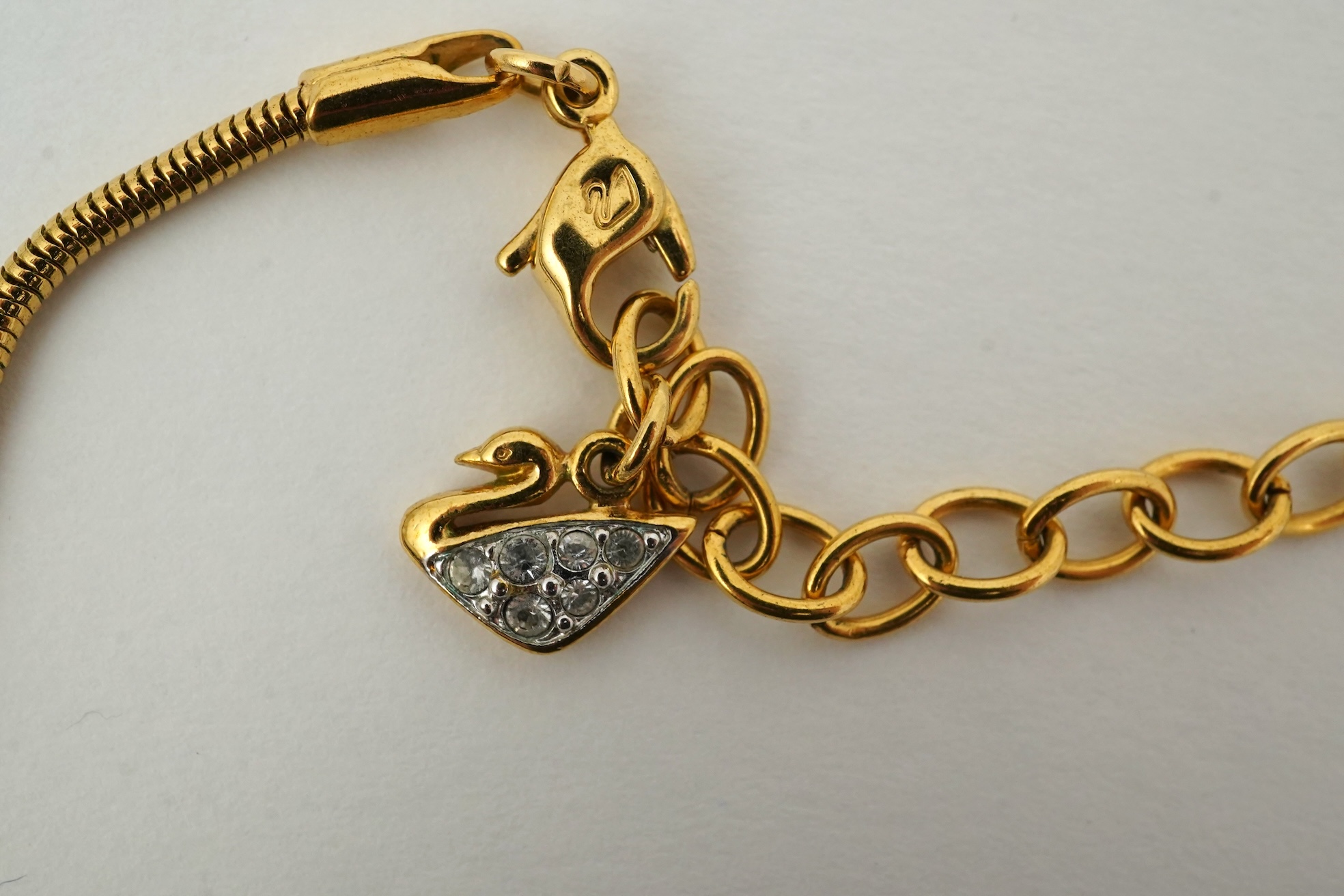 A Swarovski vintage cross necklace and ring.